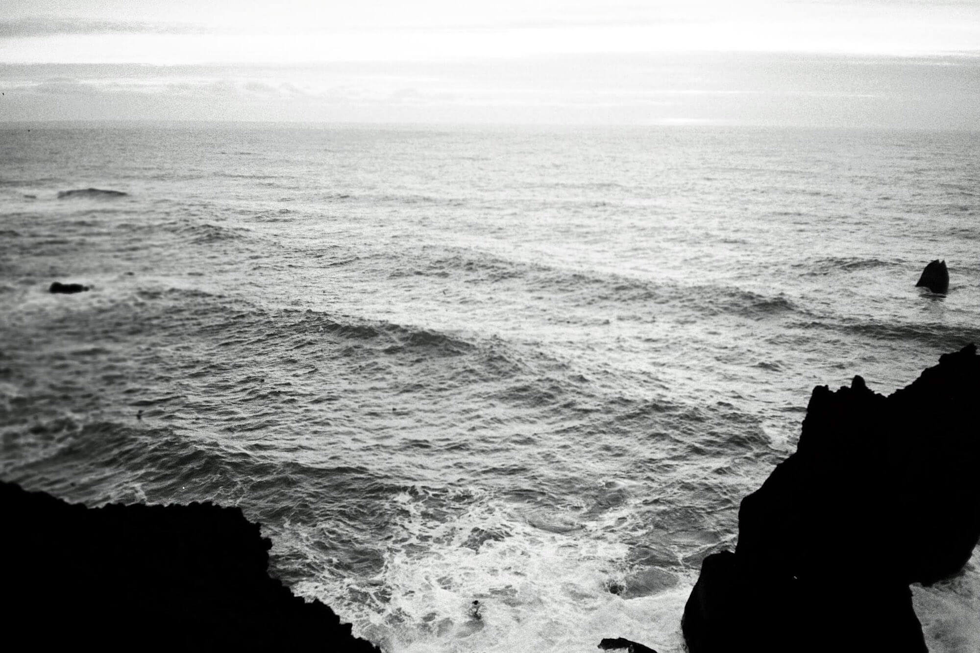 A photograph of an ocean in black and white